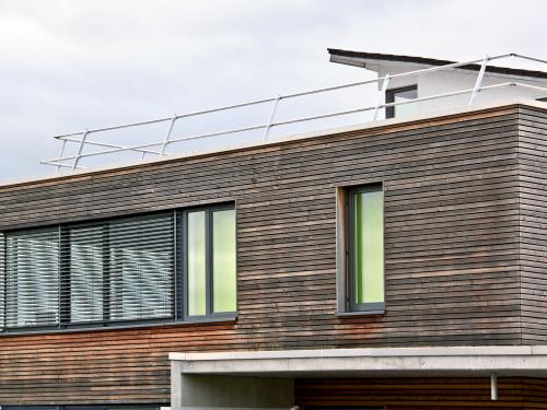 Building with a railing on the rooftop